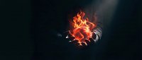 Glowing fire and sparks burst from dark background, creating dynamic energy effect for motion graphics, visual effects, and multimedia design projects.