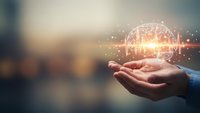 Businessman hand holding glowing brain with neural network connections representing artificial intelligence and innovation in modern technology.