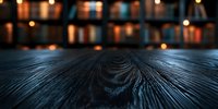 Dark wooden table surface with natural grain texture in foreground, blurred bookshelf with warm glowing lights creating cozy atmosphere in background.