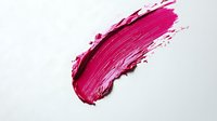 Pink lipstick smear stroke isolated on white background for cosmetic beauty makeup design projects and fashion advertising campaigns.