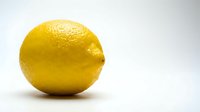 Fresh yellow lemon fruit isolated on white background for healthy cooking and citrus juice recipes.