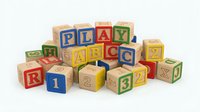 Colorful wooden alphabet and number blocks scattered on white background, educational toys for children learning letters and counting games.