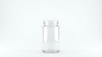 Empty clear glass jar isolated on white background for food storage, preserves, canning, kitchen organization and packaging design projects.