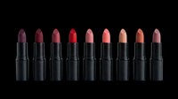 Collection of eight matte lipsticks in black tubes, shades from deep plum to nude, isolated on transparent background. Great for beauty clipart, stickers, t-shirt design.