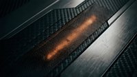 Glowing hot metal strip on carbon fiber surface with metallic bands, representing heat, energy, industrial manufacturing, and material science applications.