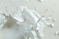 Dynamic white milk splash with droplets and waves creating abstract patterns against light background, capturing liquid motion in high-speed photography.