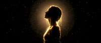 Young woman silhouette with golden light aura against starry night sky background. Spiritual meditation and inner peace concept for wellness design.