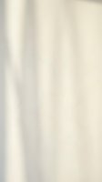 Smooth cream silk fabric with elegant vertical folds and soft lighting creating luxurious textile background for fashion and interior design projects.