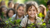 Happy child with curly hair smiling while gardening outdoors with classmates during environmental education activity. Perfect for school, ecology, and education themes.