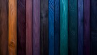 Colorful wooden planks arranged in vertical stripes, featuring rich tones from orange to deep blue, showing natural wood grain texture and patterns. For backgrounds.