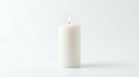 White pillar candle with a burning flame isolated on a white background, evoking calm, warmth, and serenity for home decor concepts.
