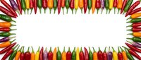 Colorful chili peppers arranged in decorative border frame on white background. Hot spicy vegetables in rainbow colors for culinary and cooking designs.