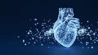 Digital wireframe human heart with glowing particles on dark blue background for medical technology and healthcare innovation concepts.