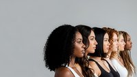 Diverse group of women in profile showing different ethnicities and hair textures representing unity, beauty standards and multicultural teamwork concepts.