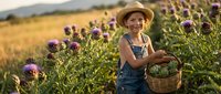 Happy young girl in straw hat and overalls harvesting purple flowers in wicker basket during golden hour sunset in rural farm field landscape.