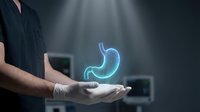 Medical professional displaying holographic stomach organ for healthcare technology and digestive system education in modern clinical environment.