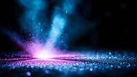 Abstract cosmic energy explosion with glowing blue and purple particles scattered across dark space creating magical light effects for digital backgrounds.