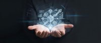 Business professional presenting holographic data analytics dashboard with charts, graphs and financial metrics floating above open palm in futuristic digital interface.