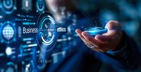 Digital business transformation concept with glowing holographic interface and hand holding futuristic technology display against dark blue background.