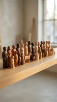 Wooden figurines of diverse people and animals arranged in a line on a table, representing community, unity, teamwork, and inclusion for business concepts.