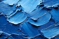 Blue oil paint texture with thick brushstrokes and impasto technique creating abstract artistic surface for creative projects and design backgrounds.