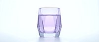 Glass of fresh water with purple tint isolated on white background, suitable for beverage, wellness, hydration and health-related design projects.