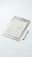 Transparent clipboard with mathematical formulas, graphs, and data tables displayed on white paper, accompanied by a stylus pen for design and educational use.