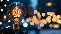 Glowing vintage light bulb with warm filament against blurred bokeh background and pine branches, creating cozy festive atmosphere for winter holidays.