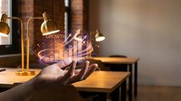 Businessperson holding glowing holographic growth chart with upward trending graph and financial data visualization in modern office workspace.