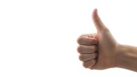 Hand showing thumbs up gesture on white background isolated for positive feedback and approval concepts.