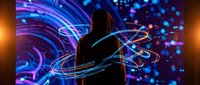 Silhouette of person surrounded by vibrant neon light trails and glowing particles in purple and blue colors creating dynamic motion effects.
