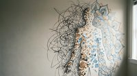 Human silhouette with intricate mandala and geometric patterns flowing from head, mindfulness meditation concept for wellness design.