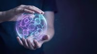 Businessman hands protecting glowing digital brain with neural network connections representing artificial intelligence and machine learning technology.