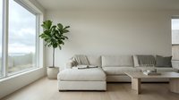 Spacious modern living room with neutral beige sectional sofa, potted plant by large window, and minimalist wooden table for interior design and home decor projects.