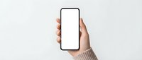 Female hand holding modern smartphone with blank white screen mockup against neutral background for app presentation and digital design projects.