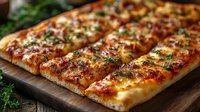 Freshly baked cheesy garlic bread topped with melted mozzarella, herbs and parsley on wooden cutting board, close up view of crispy Italian appetizer.