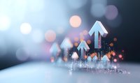 Glowing blue arrows rising upward with sparkles and bokeh effects on soft blurred background, representing business growth and success in financial markets.