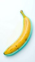 Ripe yellow banana in turquoise dish isolated on white background, ready for food and beverage design, packaging, and culinary content use.