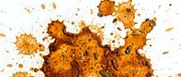 Explosion of warm spice powder creating dynamic cloud effect with scattered particles on white background, suitable for food, cooking, and culinary design projects.
