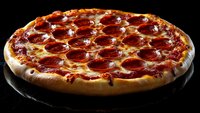 Fresh pepperoni pizza with melted mozzarella cheese and tomato sauce on dark background, dramatic side lighting highlights crispy crust and toppings.