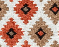 Geometric southwestern pattern in coral, beige and black on white textile background. Diamond shapes create traditional native motif with textured fabric surface.
