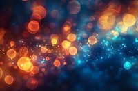 Abstract festive background with magical bokeh lights effect in orange and blue colors, perfect for holiday designs and celebration backgrounds.