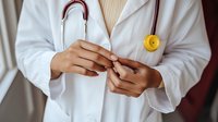 Healthcare professional using smartphone for medical communication and patient care coordination in clinical setting.