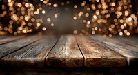 Rustic wooden table surface with warm golden bokeh lights creating festive atmosphere for product display and holiday marketing campaigns.