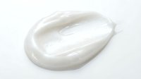 White cosmetic cream or lotion smear isolated on white background, suitable for skincare product packaging, beauty advertising, and cosmetic design projects.