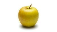 Fresh yellow-green apple isolated on white background, ready for culinary, nutrition, and healthy eating design projects.