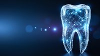 Digital tooth with glowing particles and network connections on dark blue background for dental technology and healthcare innovation concepts.