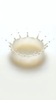 Fresh milk splash creating crown shape with droplets on white background isolated for dairy product advertising and healthy nutrition concepts.