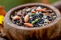 Assorted seeds and nuts in wooden bowl, nutritious mix of sunflower, pumpkin, flax and sesame seeds for healthy eating and cooking.