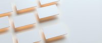 Blank white business cards with wooden holders arranged in diagonal pattern on neutral background, ready for branding and design mockups.